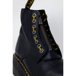 Dr. Martens Black Leather Boot with lace-up design and sturdy rubber sole, close-up view