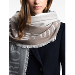 Emporio Armani Stole with multicoloured vertical bands featuring grey logo jacquard and fringed edges wrapped around a model's neck.