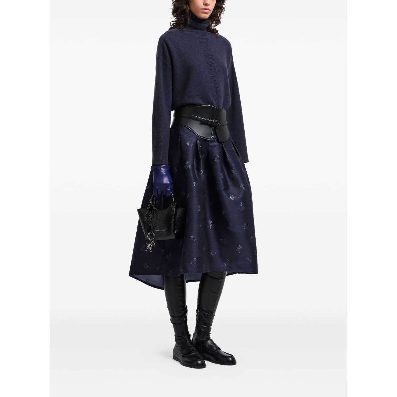 Model wearing dark blue Emporio Armani Sweaters Blue roll neck ribbed knit with long sleeves and straight hemline, styled with a black skirt.