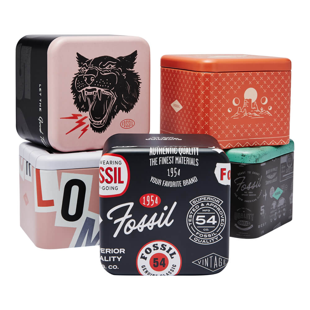 FOSSIL Mod. GWPFW1049 watch tin boxes with vintage designs, showcasing various artistic styles and Fossil branding.