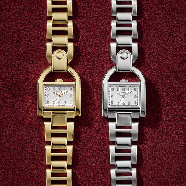 FOSSIL Mod. HARWELL wristwatch for ladies, 28mm case, elegant design, shown with gold and silver metal bracelets on red background.