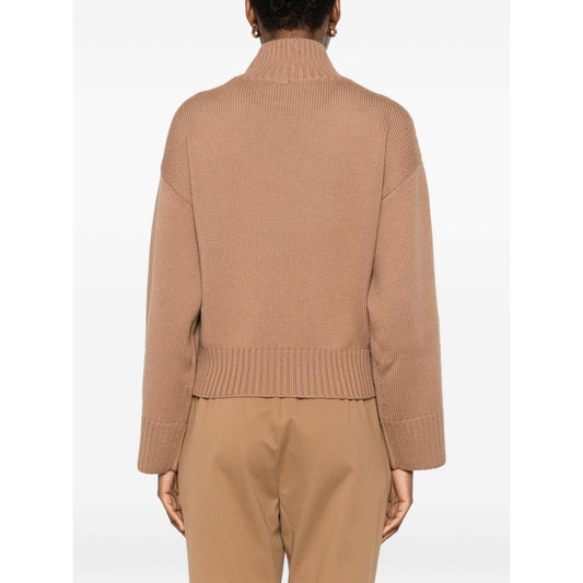 Back view of a Fabiana Filippi Sweaters Camel wool turtle-neck jumper with ribbed cuffs and hem, shown worn by a model.