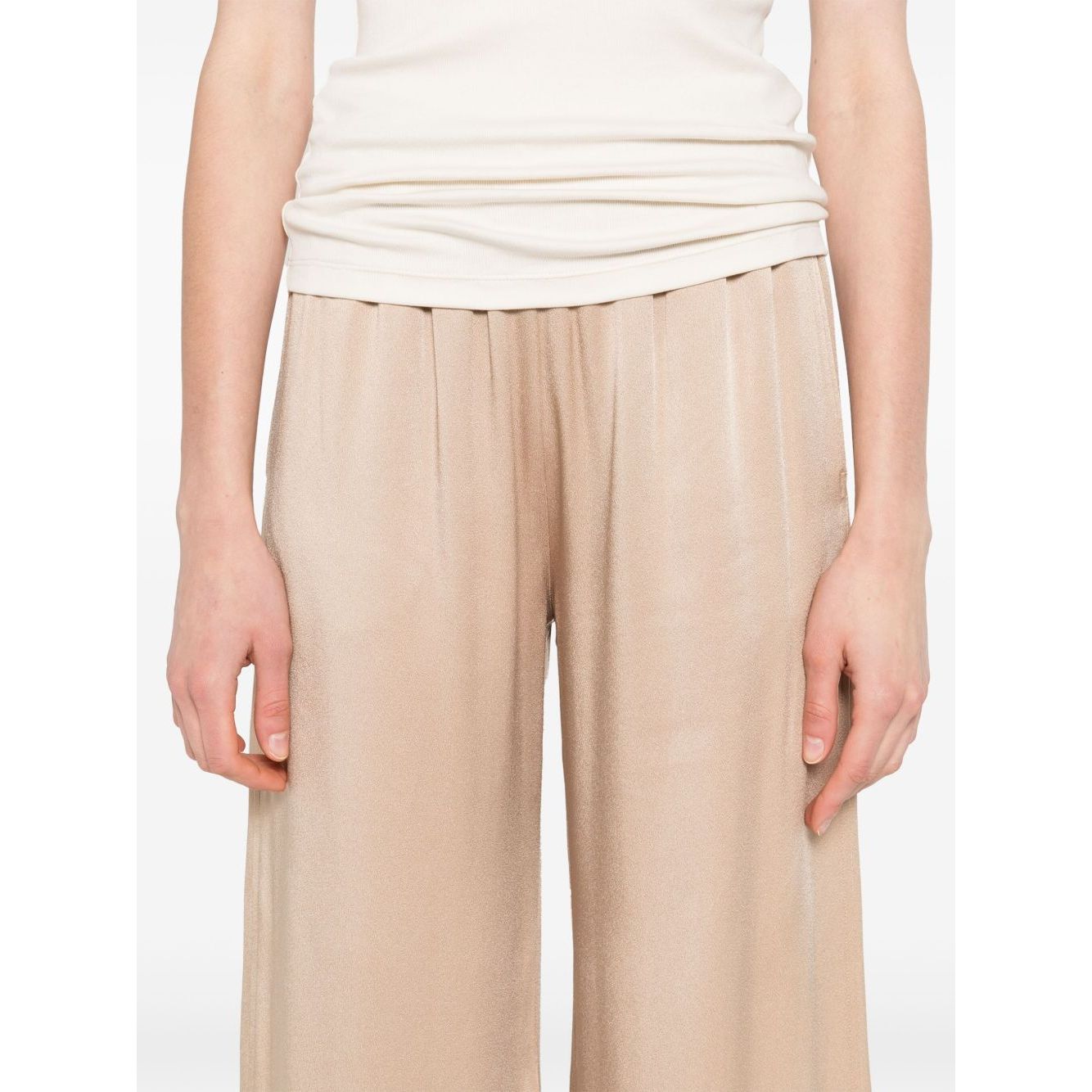 Model wearing beige Fabiana Filippi Trousers Powder, featuring an elasticated waist, side pockets, and a straight hem, wide-leg design.