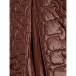 GANNI Jackets Brown quilted design with contrasting collar and snap button detail, highlighting the elegant nylon texture.