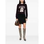 Woman wearing GANNI Sweaters Bordeaux, midnight blue crewneck with poodle design, zebra stripe, ribbed trim, styled with knee-high boots.
