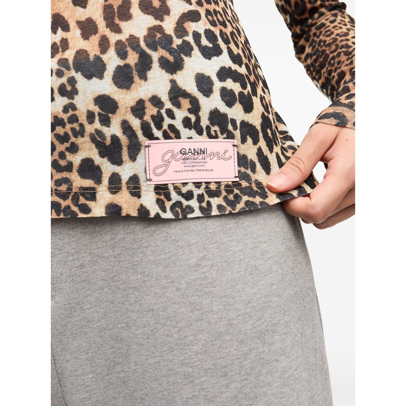 Close-up of GANNI T-shirts and Polos Brown with leopard print and logo patch detailing on light brown crew neck, long sleeve design.