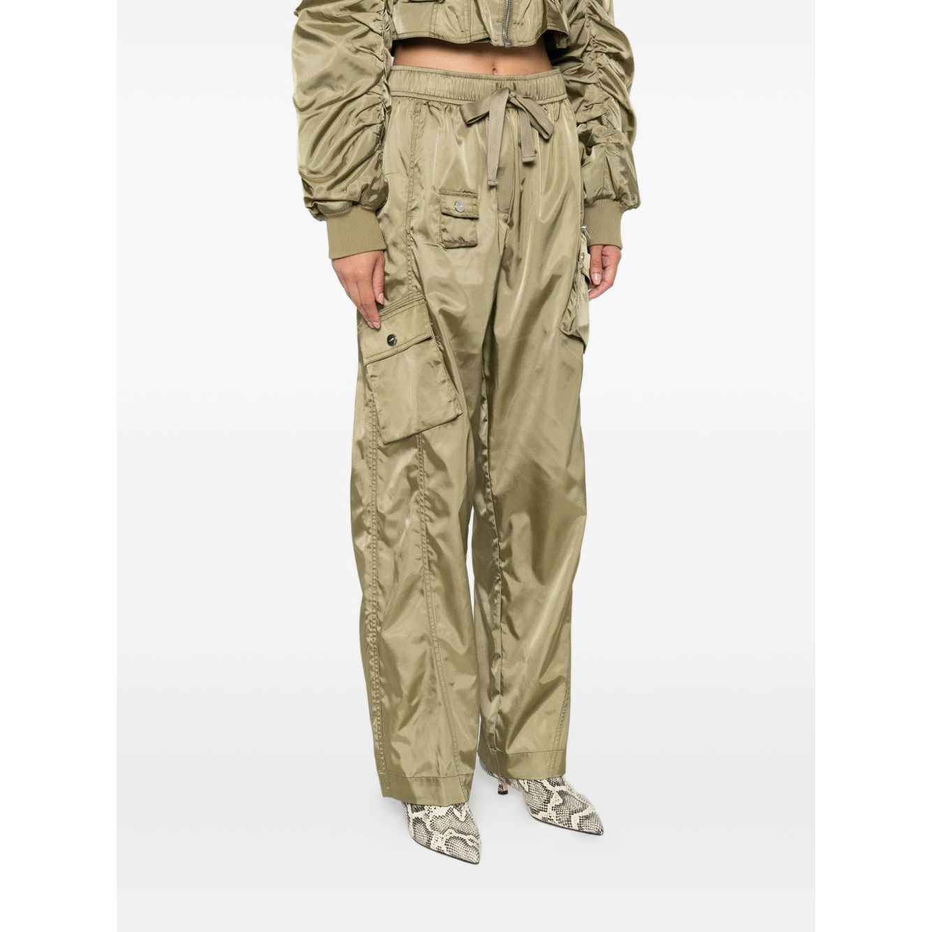 GANNI Trousers Green, sage green nylon oversized trousers with drawstring waistband, cargo pockets, and seam detailing.
