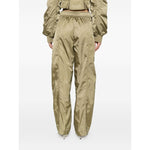 Back view of GANNI Trousers Green with elasticated waistband, cargo pockets, and seam detailing in sage green nylon.