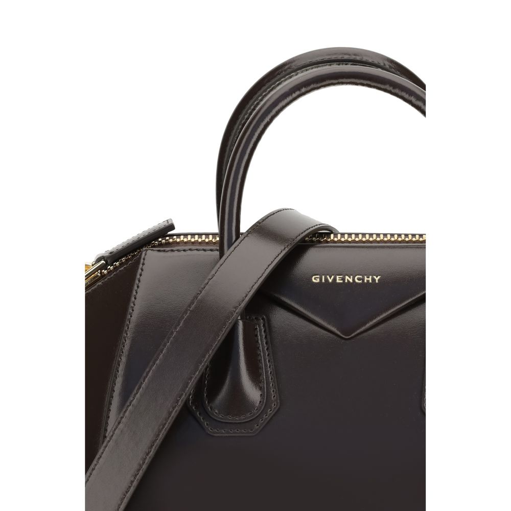 Givenchy Brown Calf Leather Bos Taurus Handbag with logo and handles, showcasing glossy finish and elegant design.