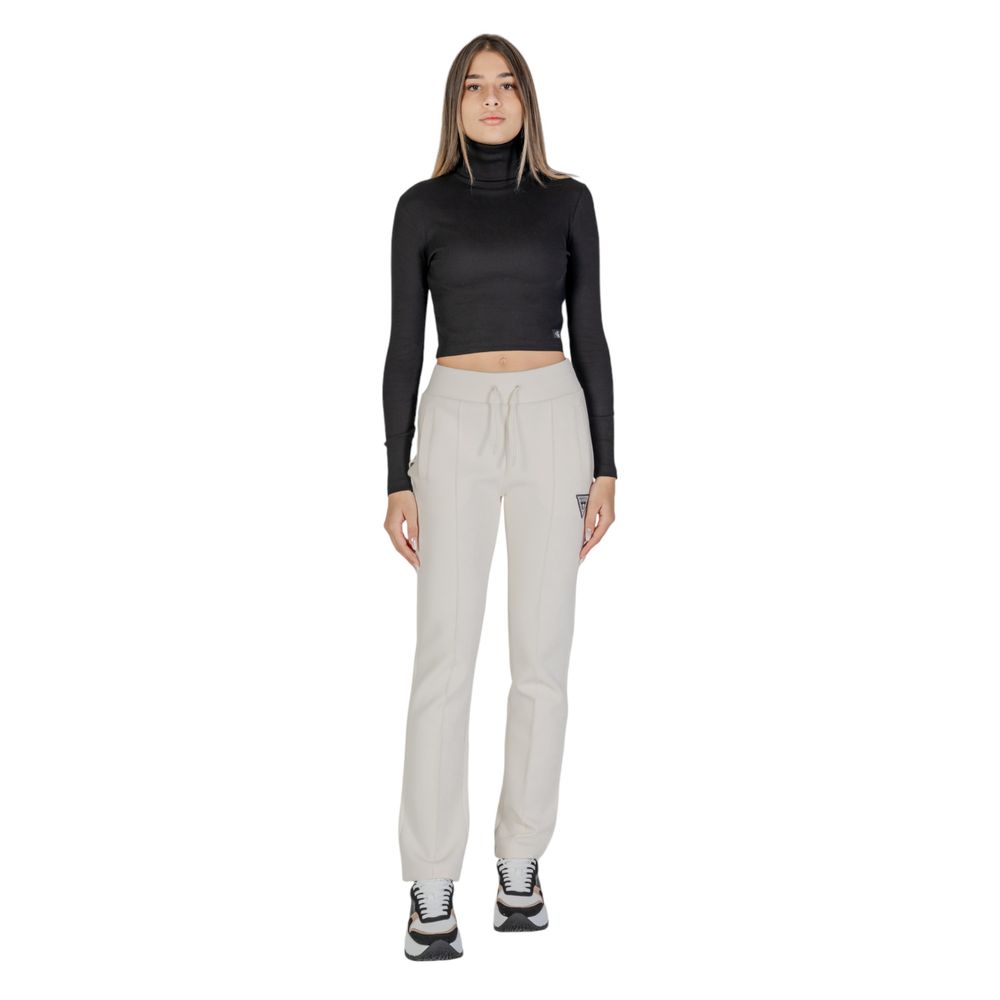 Woman wearing Guess Active Cream Cotton Joggers (Workout Pants) styled for workout or casual outing.