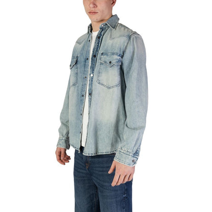Hugo Boss Light Blue Denim Shirt featuring long sleeves, snap-button closure, and chest pockets, perfect for casual and polished looks.