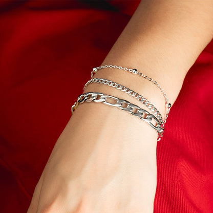 LOTUS JEWELS JEWELRY Mod. LS2339-2/1 bracelet on a woman's wrist against a red background.