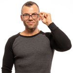 Man wearing Lozza Blue Men Glasses Frame, rectangular full-rim style, with blue plastic frame and demo lenses.