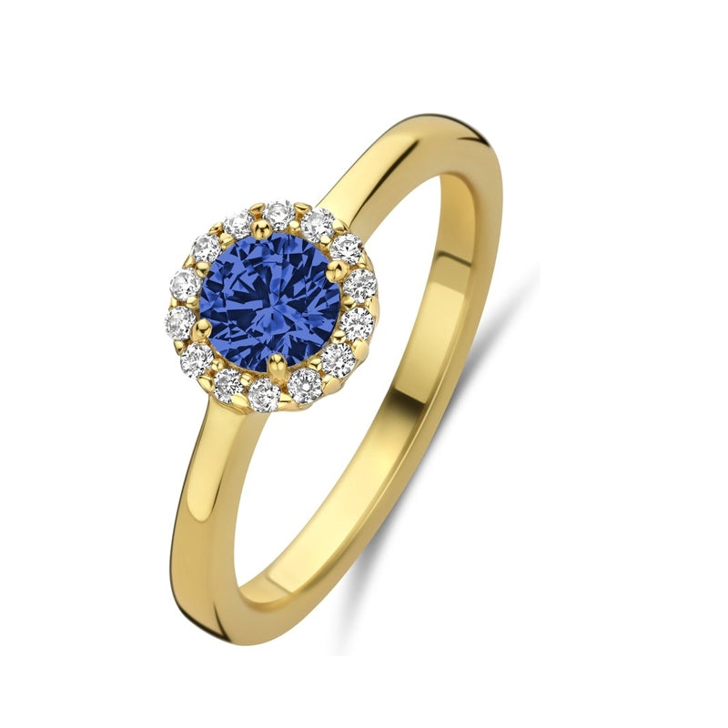 Elegant gold ring with blue gemstone, surrounded by diamonds, representing NEW BLING Mod. 9NB-1540-60 jewelry collection.