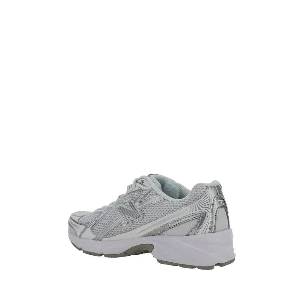 New Balance White Polyurethane Athletic Sneakers with mesh details and reinforced rubber sole, side view.