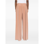 Back view of Norma Kamali Trousers Beige with elasticated waistband and wide leg design.