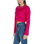 Woman wearing Only Pink Recycled Polyester Sweater from fall winter collection, featuring knitwear material with jeans