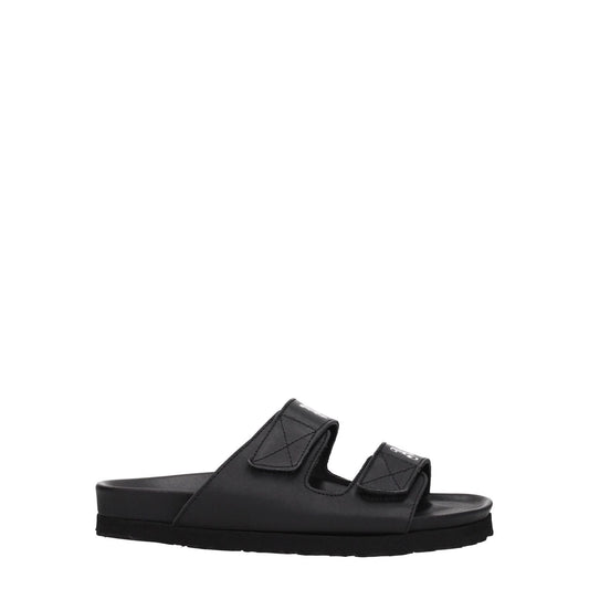 Palm Angels Black Leather Flat Sandals with strap closure and front logo, featuring a low flat heel and rubber sole for casual style.