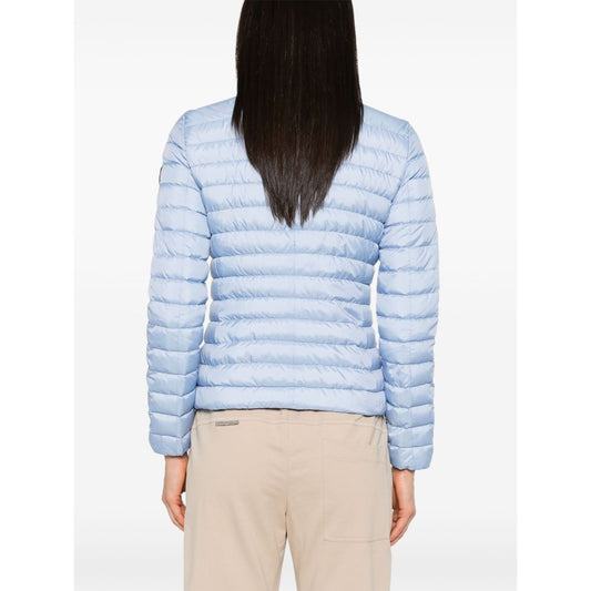 Back view of Peuterey Coats Clear Blue quilted jacket with sky blue color, two-way zip, and logo patch on sleeve. Size 40 IT.