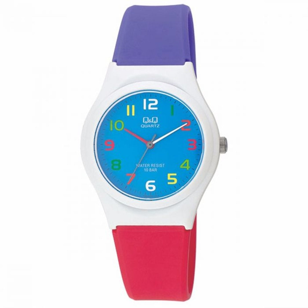 Q&Q ATTRACTIVE Mod. VQ86J009Y wristwatch with colorful dial, metal case, quartz movement, displayed on a purple and red strap. Official packaging.