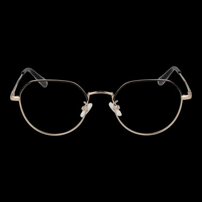Gold-rimmed eyeglasses with black temple tips against black background
