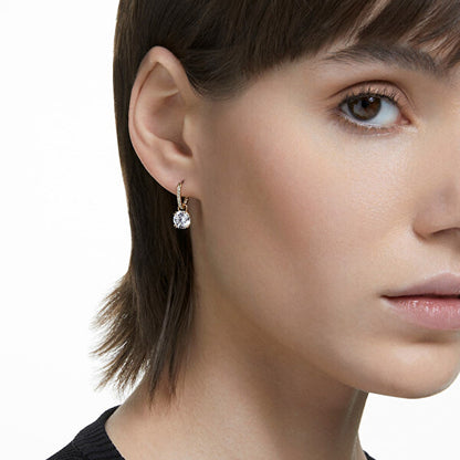 Woman wearing SWAROVSKI Mod. 5638802 earring showcasing elegant style and design.