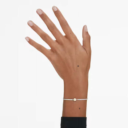 Elegant hand wearing a delicate bracelet showcasing subtle charm and sophistication.