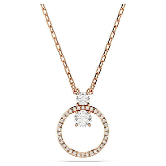 Elegant rose gold necklace with circular pendant and crystal details. Perfect accessory for a stylish outfit. Fashion jewelry.