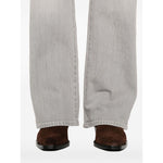 Seven Jeans Grey straight leg denim with brown shoes, featuring five-pocket and button fly design, shown from back view.