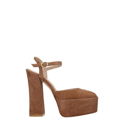 Stuart Weitzman Beige Leather Platforms with high heel and buckle closure. Suede in beige with gold accents and round toe design.
