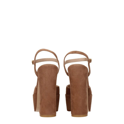 Stuart Weitzman Beige Leather Platforms rear view showcasing suede sandals with high heels and buckle closure.