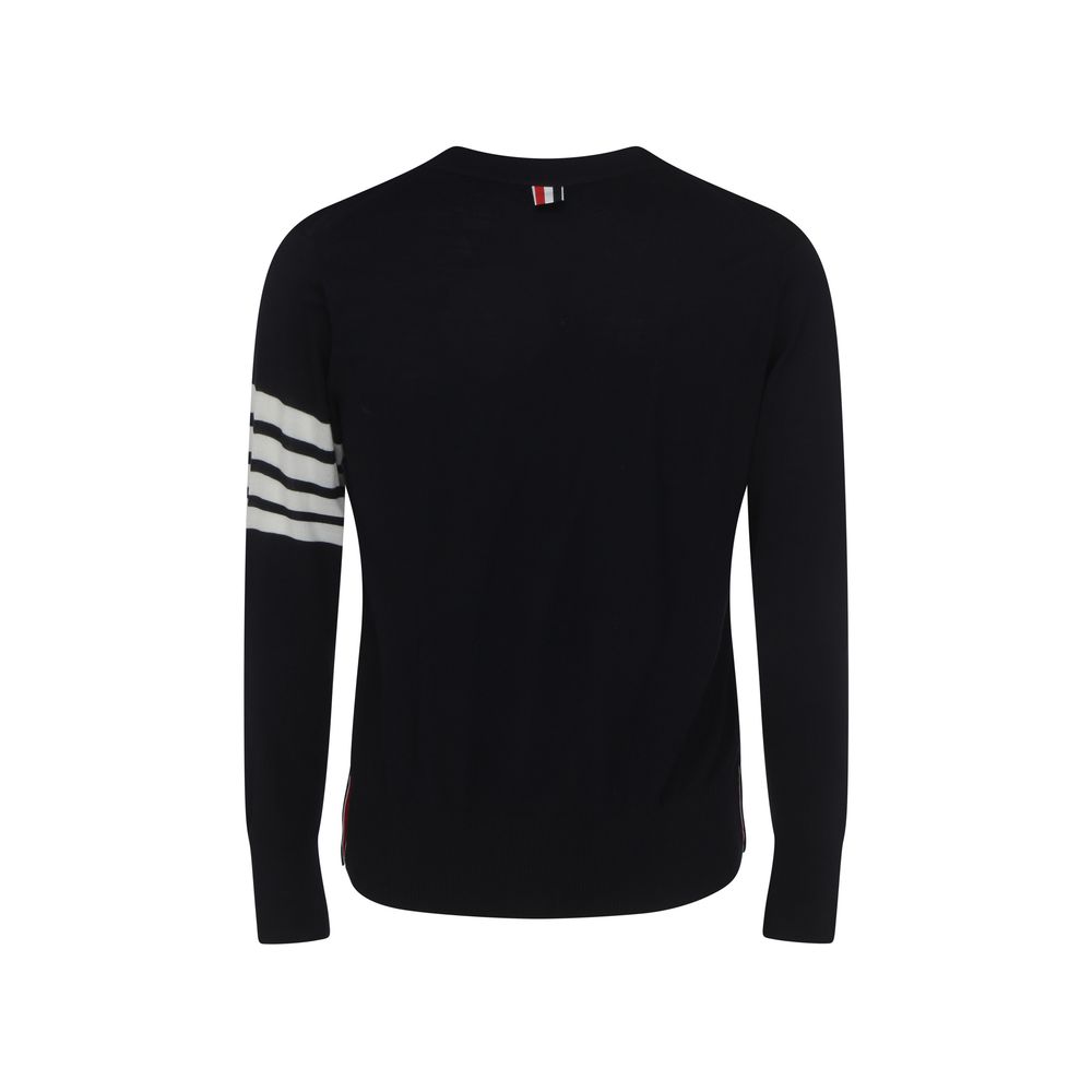 Back view of Thom Browne Cardigan with iconic logo bands and striped cuffs, made from fleece wool, showcasing AW25 design.