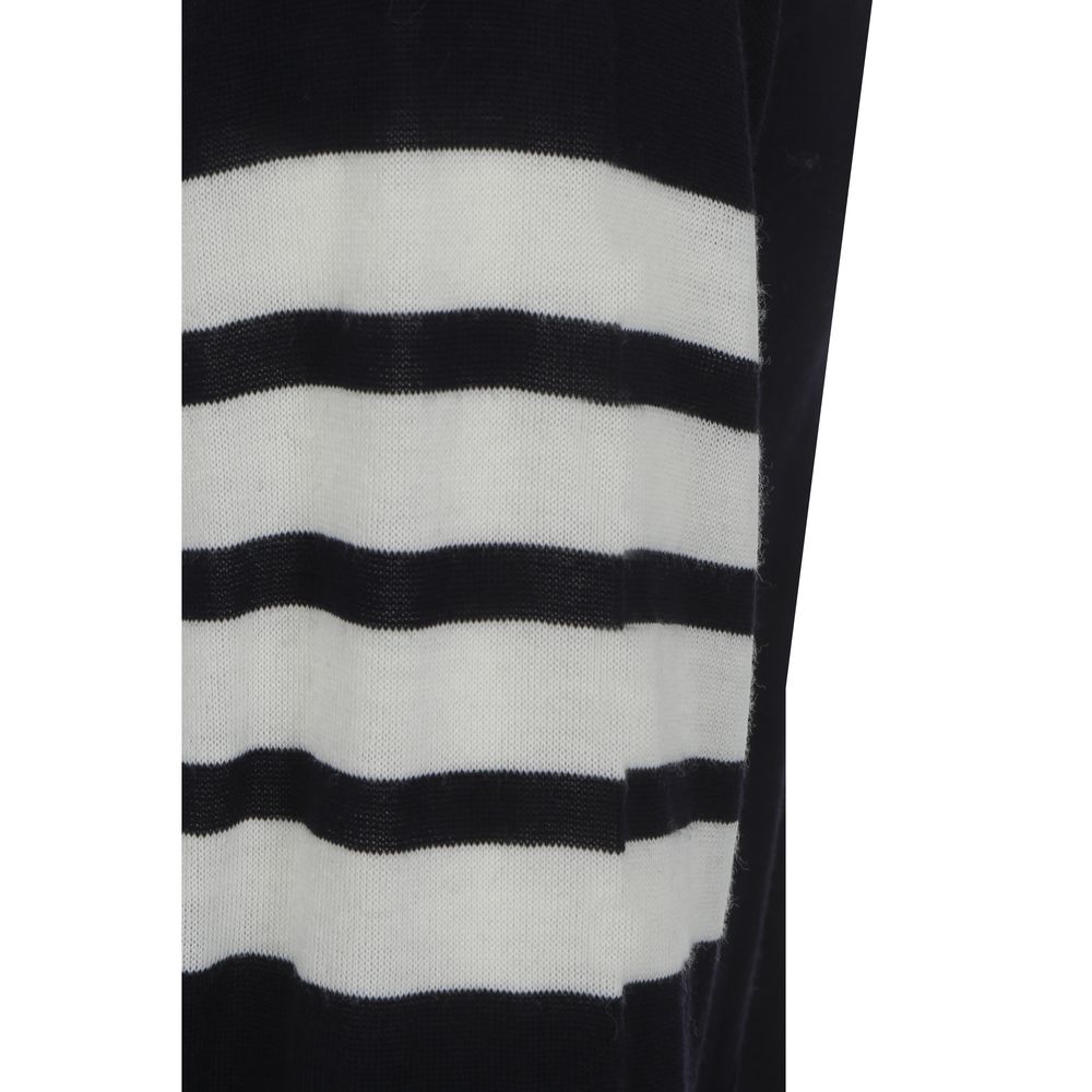 Close-up of Thom Browne Cardigan featuring striped black and white cuffs, fleece wool fabric, part of the iconic design.