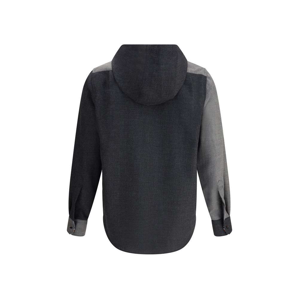 Back view of Thom Browne Hooded Shirt Jacket with asymmetrical hem, showing drawstring hood and buttoned cuffs.
