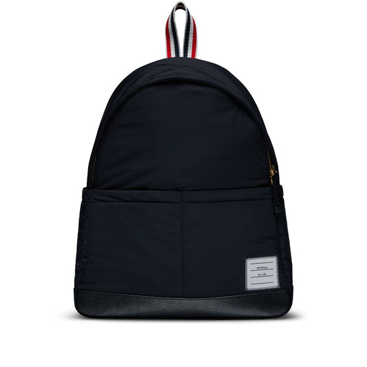 Thom Browne Multipocket backpack, black with logo appliqué, two-way zip, single handle, adjustable straps, front patch pocket, and stripe detail.