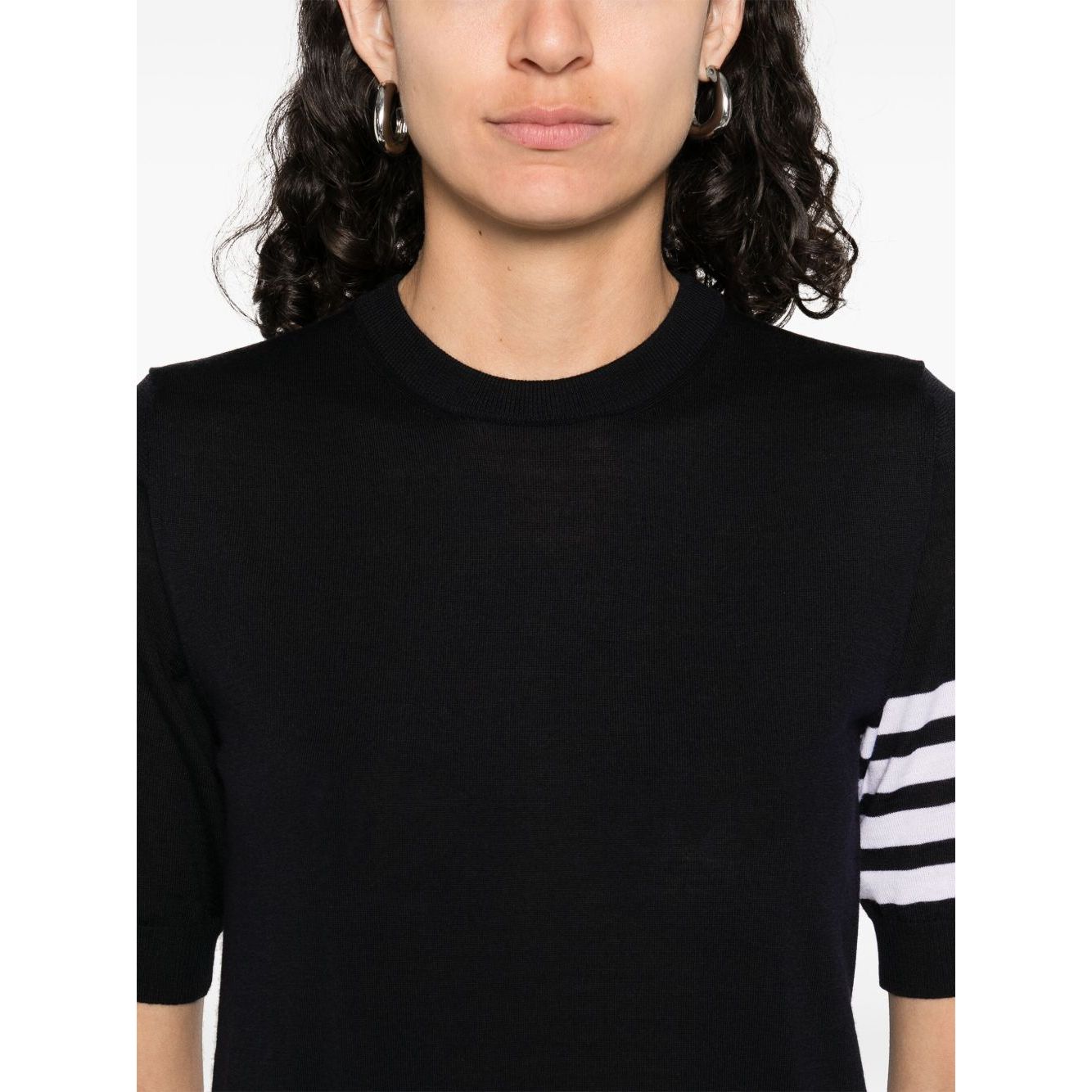 Woman wearing Thom Browne Sweaters Blue navy crew neck with 4Bar stripe detail and grosgrain tabs.