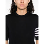 Woman wearing Thom Browne Sweaters Blue navy crew neck with 4Bar stripe detail and grosgrain tabs.