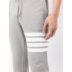 Thom Browne Trousers Grey with signature 4-Bar stripe and grosgrain loop tab, featuring a drawstring waist and side slit pockets.