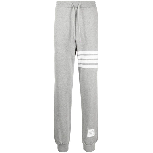Thom Browne Trousers Grey with 4-Bar stripe, grosgrain loop tab, drawstring waist, side slit pockets, rear welt pocket.
