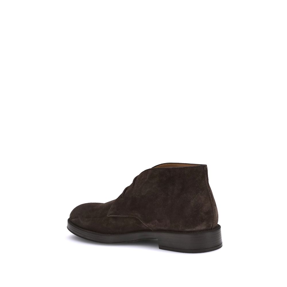 Back view of Tod's Brown Calf Leather Bos Taurus Ankle Boots with embossed monogram and light rubber sole for AW25 season.