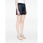 Tom Ford Shorts Blue featuring navy blue silk, elasticated logo waistband, worn by model, true to size fit, fashionable for summer.