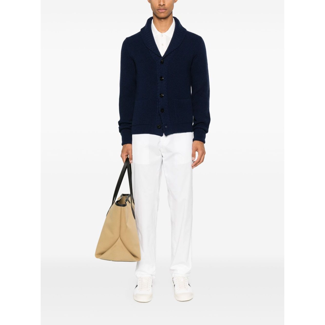 Man wearing Tom Ford T-shirts and Polos White with black cardigan and holding beige bag