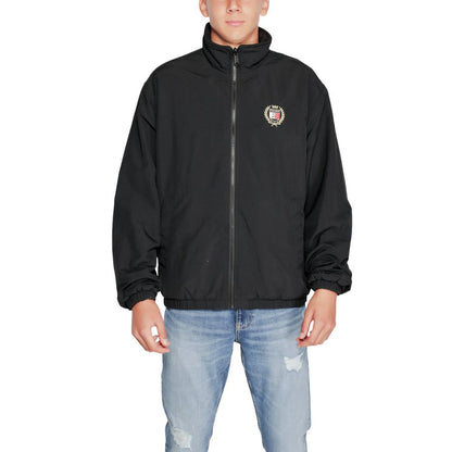 Tommy Hilfiger Jeans Black Recycled Polyester Shell Jacket worn by a male model, showcasing front design and embroidered detail.