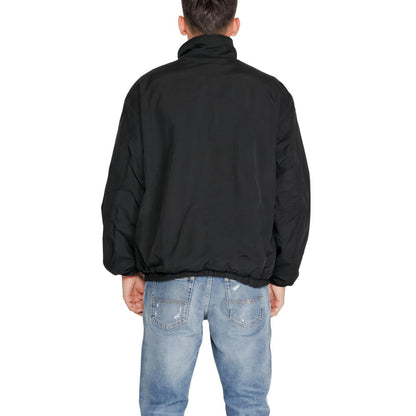 Back view of Tommy Hilfiger Jeans Black Recycled Polyester Shell Jacket worn by a model