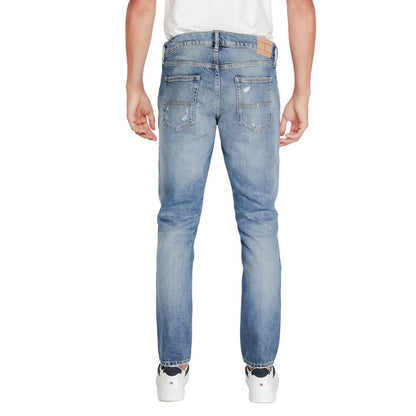 Back view of Tommy Hilfiger Jeans Blue Cotton Slim Fit Jeans for men, showcasing a modern tapered fit and sustainable cotton blend.