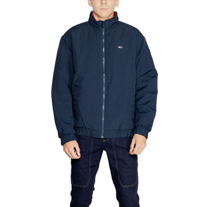 Man wearing Tommy Hilfiger Jeans Blue Polyamide Bomber with padded insulation.