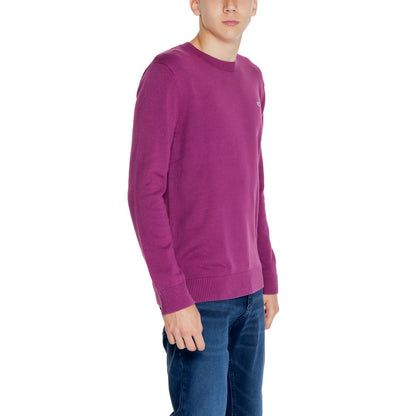 Man wearing Tommy Hilfiger Jeans Purple Organic Cotton Sweatshirt, crew neck style with ribbed edges