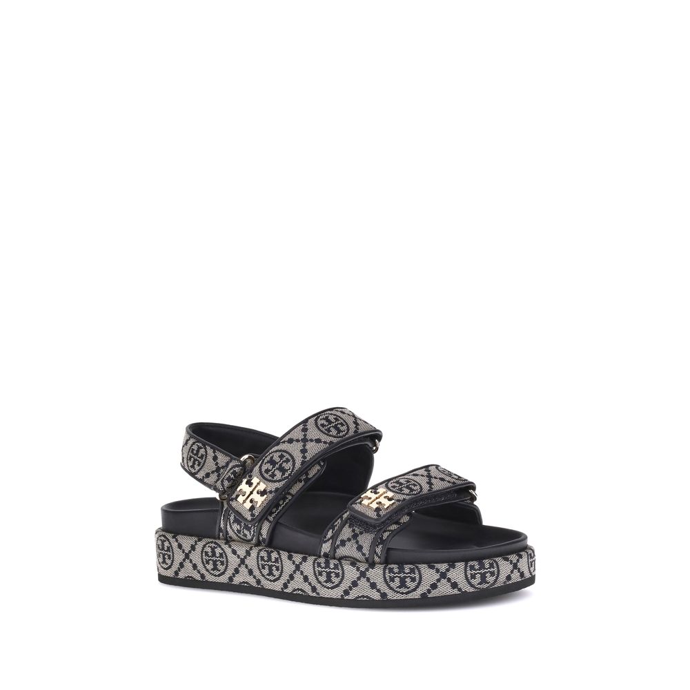 Tory Burch Kira Sandals in jacquard with Monogram T, featuring Velcro straps, rubber sole, and logo embellishments for casual style.