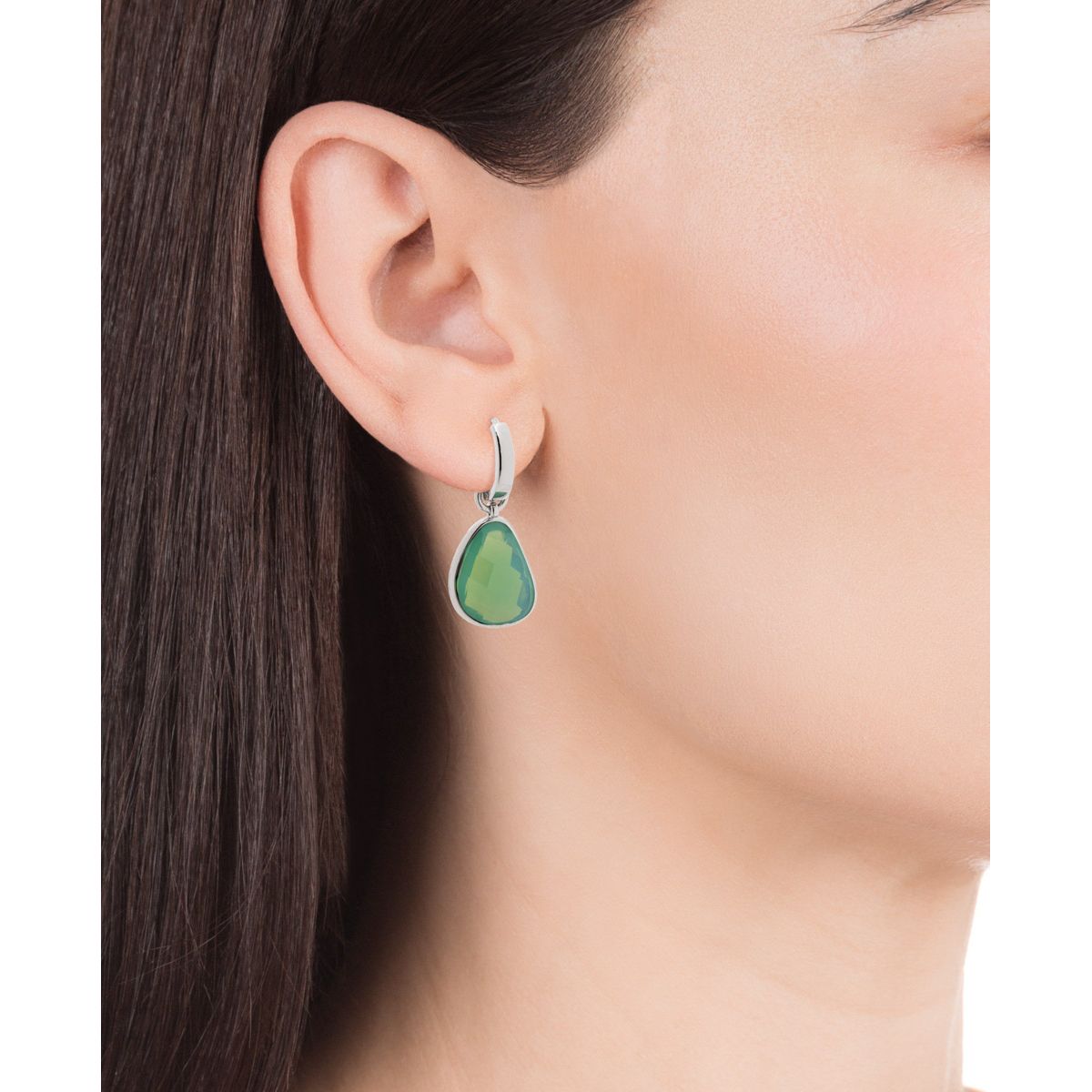 Woman wearing silver VICEROY JEWELS Mod. 15108E000-38 earrings with green stone, designed for elegance and style.