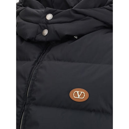 Valentino Black Goose Down Sleeveless Jacket with leather logo patch and removable hood, showcasing quilted design, AW25 collection.
